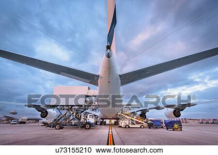 Ground crew loading A380 aircraft at airport View Large Photo Image Stock Image - Ground crew loading A380 aircraft at airport. Fotosearch