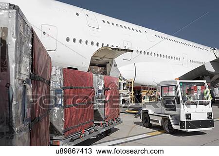 Ground crew loading A380 jet aircraft at airport View Large Photo Image Stock Image - Ground crew loading A380 jet aircraft at airport. Fotosearch