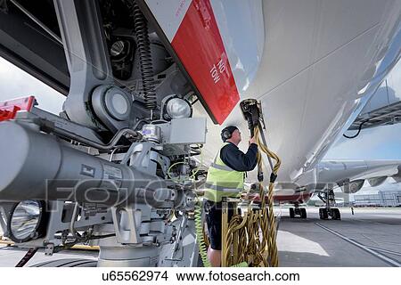 Picture - Ground crew service worker with A380 aircraft. Fotosearch