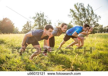 Group of friends running, racing, in field View Large Photo Image Stock Image - Group of friends running, racing, in field. Fotosearch