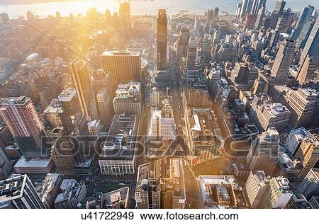 Stock Photo - High angle cityscape of mid town Manhattan toward Hudson River, New York, USA. Fotosearch
