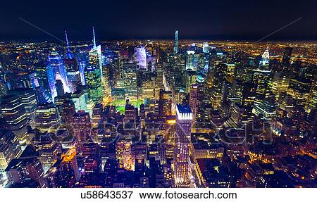 High angle cityscape of midtown Manhattan at night, New York, USA View Large Photo Image Stock Photo - High angle cityscape of midtown Manhattan at night, New York, USA. Fotosearch