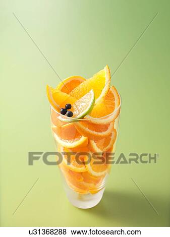 Ingredients in drinking glass for orange, lime and juniper berry fruit juice View Large Photo Image Stock Photo - Ingredients in drinking glass for orange, lime and juniper berry fruit juice. Fotosearch
