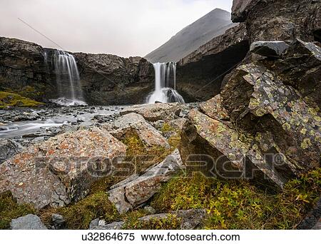 Stock Photography - Landscape with waterfall at Innstifoss, Iceland. Fotosearch
