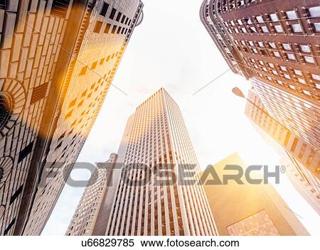 Low angle view of sunlit office skyscrapers, Manhattan financial district, New York, USA View Large Photo Image Stock Photography - Low angle view of sunlit office skyscrapers, Manhattan financial district, New York, USA. Fotosearch