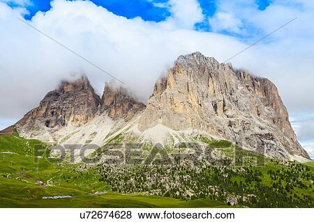 Stock Photo - Low cloud and rock formation, Dolomites, Italy. Fotosearch