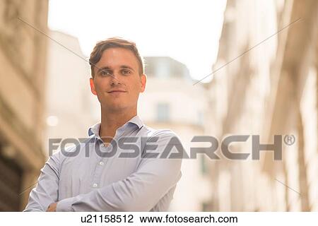 Stock Image - Man with arms crossed. Fotosearch
