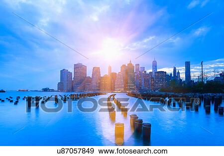 Stock Photo - Manhattan financial district skyline and One World Trade Centre at sunset, New York, USA. Fotosearch