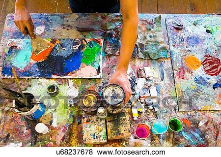 Mid adult man, painting, mid section, elevated view View Large Photo Image Stock Photo - Mid adult man, painting, mid section, elevated view. Fotosearch