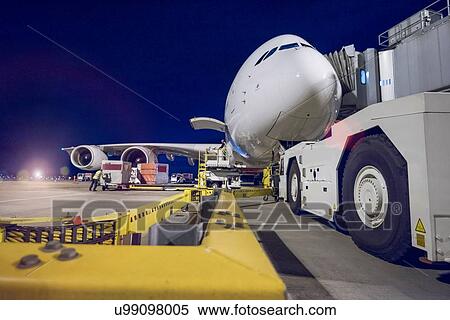 Stock Photography - Night over A380 aircraft on stand at airport. Fotosearch