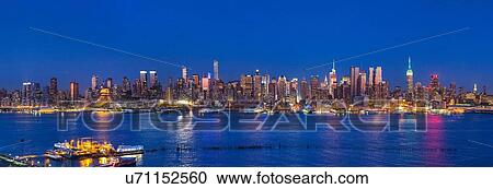 Night time panoramic mid town Manhattan skyline, New York, USA View Large Photo Image Stock Image - Night time panoramic mid town Manhattan skyline, New York, USA. Fotosearch
