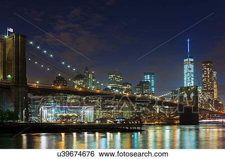 Night view of Manhattan financial district and Brooklyn bridge, New York, USA View Large Photo Image Stock Photograph - Night view of Manhattan financial district and Brooklyn bridge, New York, USA. Fotosearch