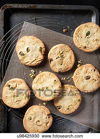 Overhead view of crunchy pistachio and almond cookies on baking tray View Large Photo Image Stock Image - Overhead view of crunchy pistachio and almond cookies on baking tray. Fotosearch