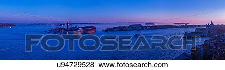 Stock Photo - Panoramic view of an island in Venetian Lagoon at sunset, Italy. Fotosearch