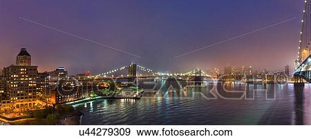 Panoramic view of Brooklyn and Manhattan bridges at night, New York, USA View Large Photo Image Stock Photo - Panoramic view of Brooklyn and Manhattan bridges at night, New York, USA. Fotosearch