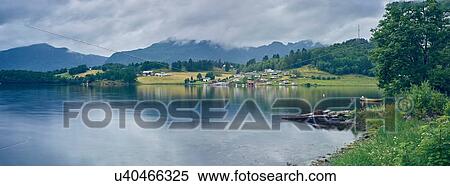 Stock Photography - Panoramic view of fjord distant village, Etne, Norway. Fotosearch