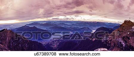 Stock Photo - Panoramic view of Lake Lugano at dawn, Switzerland. Fotosearch