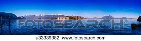 Stock Image - Panoramic view of Lake Maggiore, Italy. Fotosearch