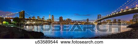 Picture - Panoramic view of Manhattan and Brooklyn bridges at night, New York, USA. Fotosearch