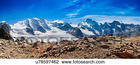 Panoramic view of rugged snow covered mountains, Diavolezza, Switzerland View Large Photo Image Stock Image - Panoramic view of rugged snow covered mountains, Diavolezza, Switzerland. Fotosearch