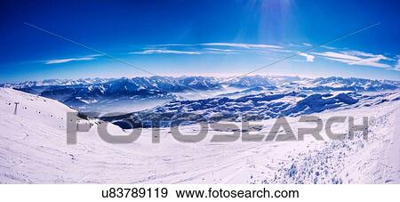 Stock Photo - Panoramic view of snow covered mountains, Arosa, Switzerland. Fotosearch
