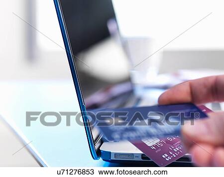 Person using credit card to buy online View Large Photo Image Stock Image - Person using credit card to buy online. Fotosearch