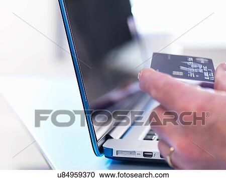 Person using credit card to buy online View Large Photo Image Stock Image - Person using credit card to buy online. Fotosearch