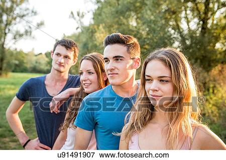 Portrait of group of friends in rural environment, smiling View Large Photo Image Stock Photo - Portrait of group of friends in rural environment, smiling. Fotosearch