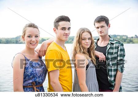 Portrait of group of friends, outdoors, smiling View Large Photo Image Picture - Portrait of group of friends, outdoors, smiling. Fotosearch
