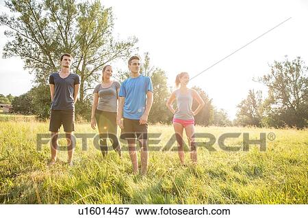 Portrait of group of friends, standing in field View Large Photo Image Stock Photo - Portrait of group of friends, standing in field. Fotosearch