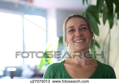 Portrait of mid adult woman looking away smiling View Large Photo Image Stock Image - Portrait of mid adult woman looking away smiling. Fotosearch