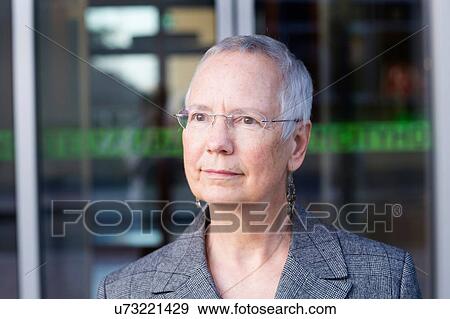 Portrait of senior businesswoman with short grey hair outside hotel entrance View Large Photo Image Stock Photo - Portrait of senior businesswoman with short grey hair outside hotel entrance. Fotosearch