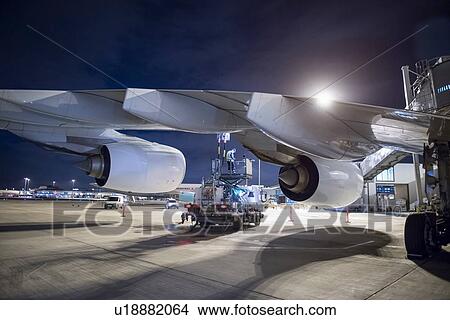 Picture - Refuelling A380 aircraft on runway at night. Fotosearch