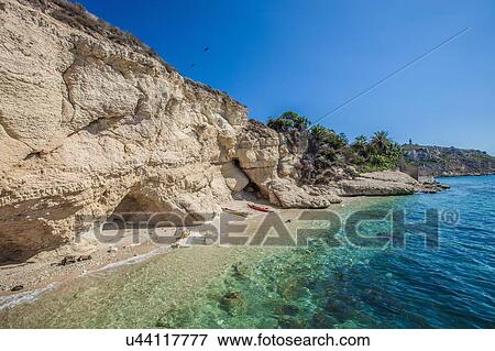 Stock Photo - Rock formation on beach, Cagliari, Sardinia, Italy. Fotosearch