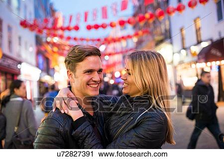 Romantic young couple on street at night, Chinatown, London, England, UK View Large Photo Image Stock Image - Romantic young couple on street at night, Chinatown, London, England, UK. Fotosearch