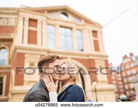 Stock Photography - Romantic young couple outside Albert Hall, London, England, UK. Fotosearch