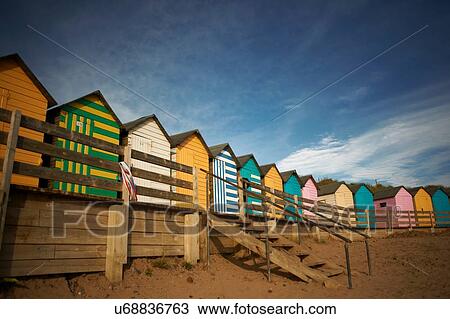 Stock Image - Row of colourful beachhuts, Bude, Cornwall, UK. Fotosearch
