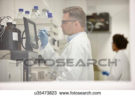 Scientists working in laboratory View Large Photo Image Stock Image - Scientists working in laboratory. Fotosearch