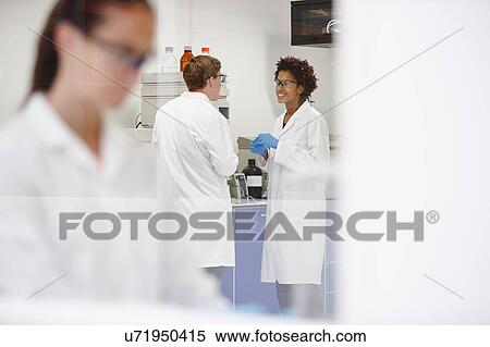 Scientists working in laboratory View Large Photo Image Stock Photography - Scientists working in laboratory. Fotosearch