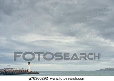 Stock Image - Seascape and harbour wall, Cumbria, UK. Fotosearch