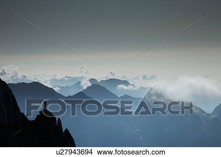 Silhouetted lone climber looking out at mountain view, Zermatt, Canton Wallis, Switzerland View Large Photo Image Picture - Silhouetted lone climber looking out at mountain view, Zermatt, Canton Wallis, Switzerland. Fotosearch