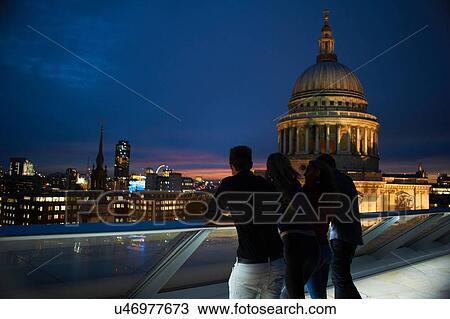Silhouetted rear view of two young couples looking out to St Pauls at night, London, UK View Large Photo Image Stock Image - Silhouetted rear view of two young couples looking out to St Pauls at night, London, UK. Fotosearch
