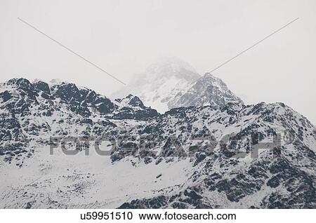 Snow capped misty mountain range, Nepal View Large Photo Image Stock Image - Snow capped misty mountain range, Nepal. Fotosearch