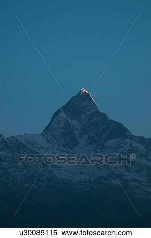 Snow capped mountain in darkness, Nepal View Large Photo Image Stock Photography - Snow capped mountain in darkness, Nepal. Fotosearch