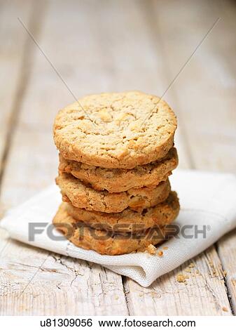 Stack of apple crumble cookies on tea towel View Large Photo Image Stock Photograph - Stack of apple crumble cookies on tea towel. Fotosearch