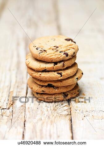 Stack of blueberry and oat cookies on wood View Large Photo Image Stock Photo - Stack of blueberry and oat cookies on wood. Fotosearch