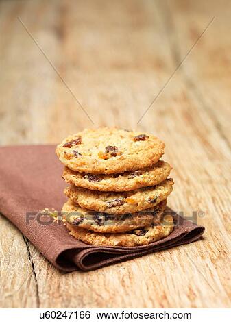 Stock Photograph - Stack of flapjack cookies on tea towel. Fotosearch