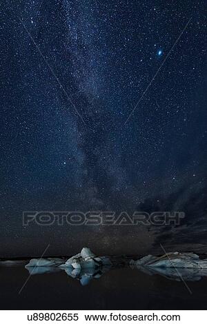 Starry sky and icebergs at night, Jokulsarlon, Iceland View Large Photo Image Stock Photography - Starry sky and icebergs at night, Jokulsarlon, Iceland. Fotosearch