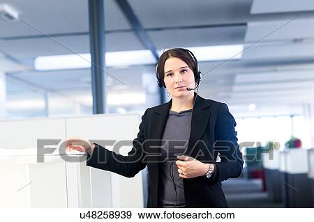 Stock Photo - Telephonist in office. Fotosearch