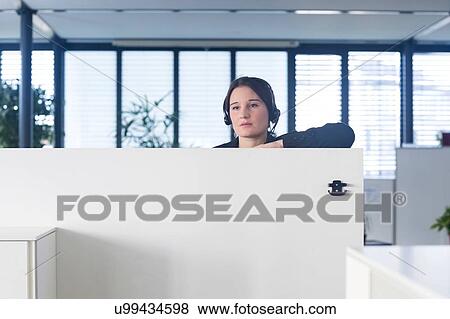 Stock Photo - Telephonist working in office. Fotosearch